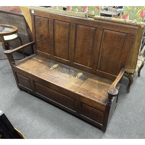 1166 - An 18th century panelled oak box seat settle, width 153cm, depth 51cm, height 108cm