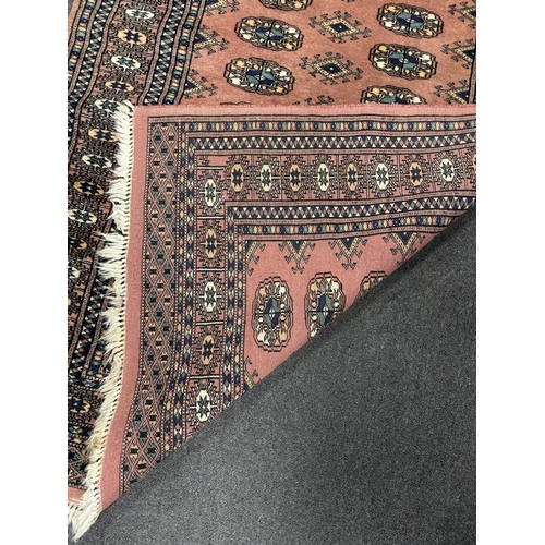 1188 - A Bokhara peach ground rug, 164 x 102cm