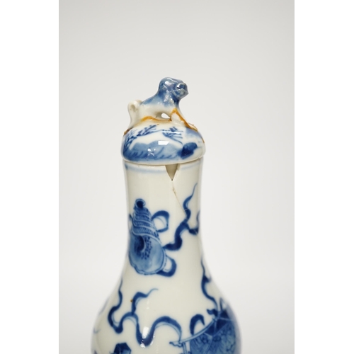 1251 - A late 19th century Chinese blue and white double gourd vase and cover 26cm high