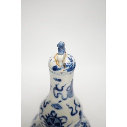 1251 - A late 19th century Chinese blue and white double gourd vase and cover 26cm high