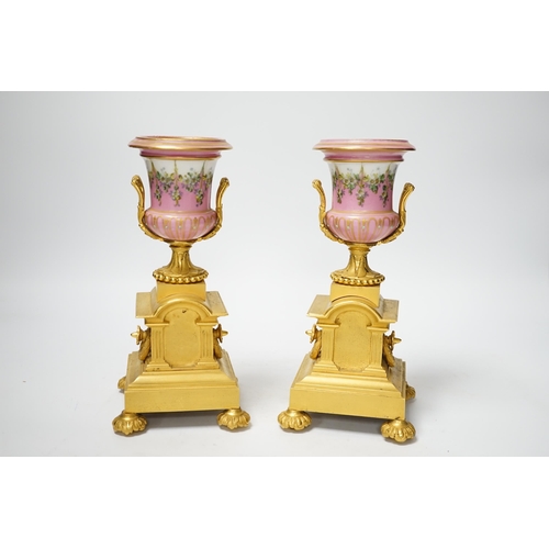 1252 - A pair of late 19th century French ormolu and pink floral porcelain urns, 20.5cm high