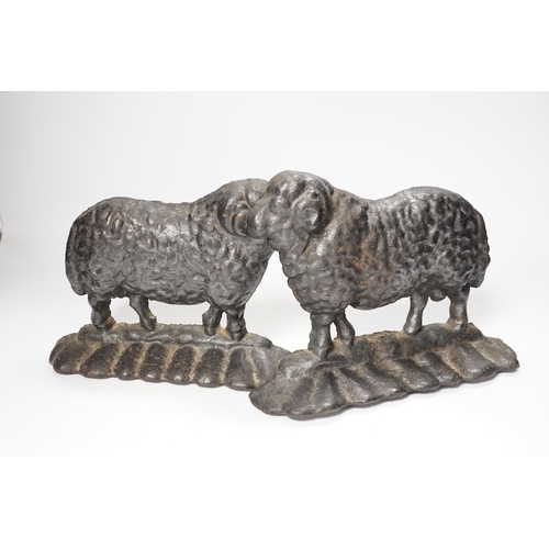 1259 - Two 19th century cast iron door stop sheep, tallest 19cm high