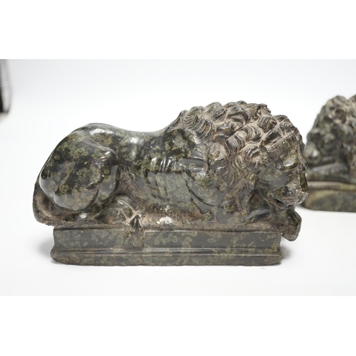 1290 - A pair of carved serpentine models of the Lucerne lions, 16cm wide