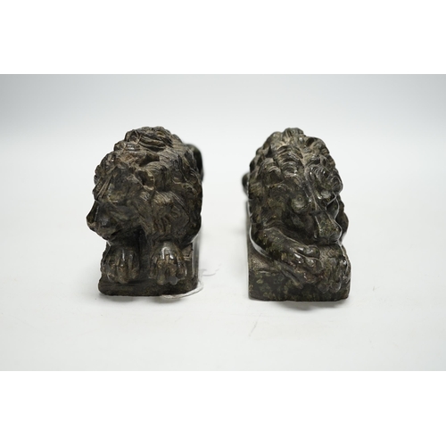 1290 - A pair of carved serpentine models of the Lucerne lions, 16cm wide