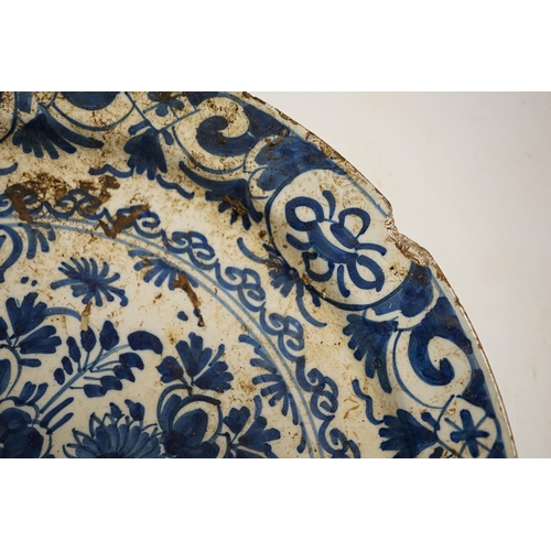 1297 - An 18th century Delft charger, 34cm