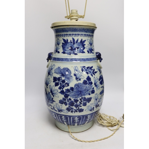 1298 - A late 19th century Chinese export porcelain blue and white Hu vase, painted with peaches (converted... 