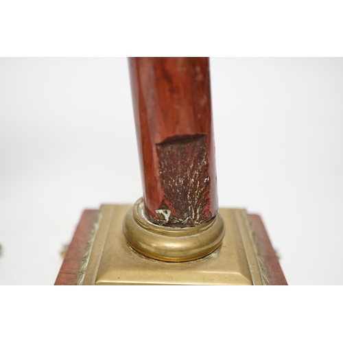 1303 - A pair of 19th century brass mounted rouge marble candlesticks, 29cm (a.f.)