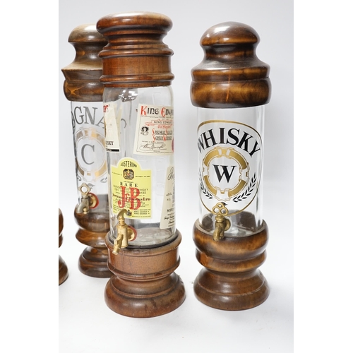 1311 - Four spirit vessels, whisky, pastis, cognac, and another, tallest, 38cm