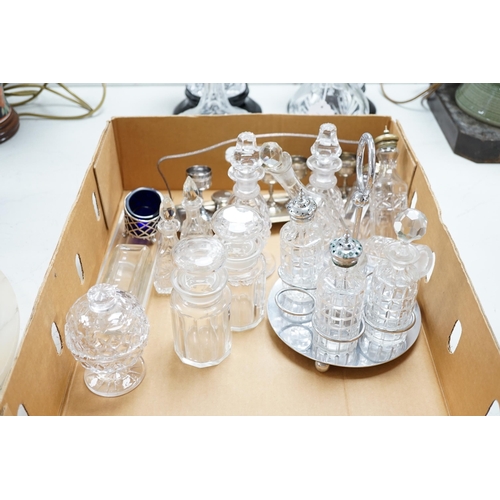 1315 - A pair of cut glass vases on stands two decanters and a collection of small glass bottles and silver... 