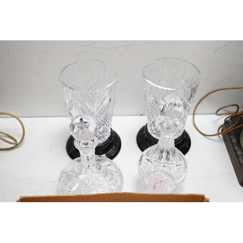 1315 - A pair of cut glass vases on stands two decanters and a collection of small glass bottles and silver... 