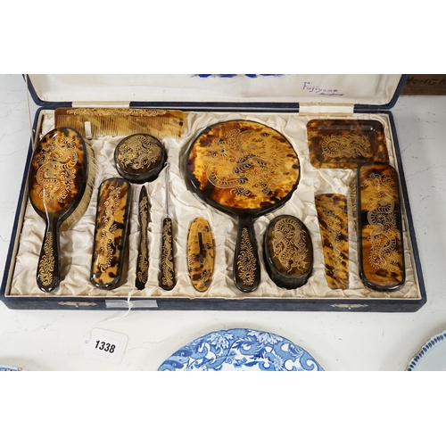 1338 - A cased Japanese tortoiseshell dragon decorated dressing table set, c.1940 (with original packing ca... 