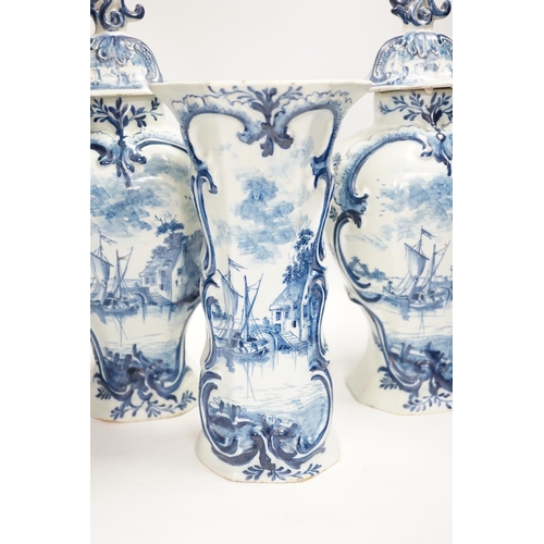 1340 - A Delft garniture of three vases, c.1770, tallest 41cm high