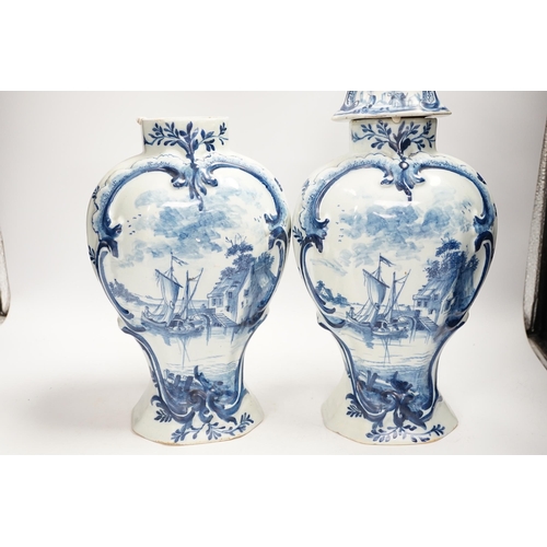 1340 - A Delft garniture of three vases, c.1770, tallest 41cm high