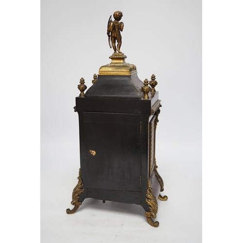 1357 - A late 19th century French tortoiseshell veneered mantel clock with cupid top, striking on a coiled ... 