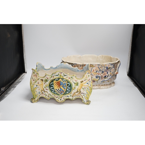 1359 - A Two French faience pottery planters, one with armorial crest and another, longer 34cm (2)