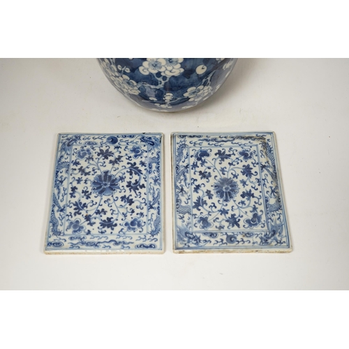 1363 - A 19th century Chinese blue and white prunus jar and cover, together with two similar tiles, jar 21c... 