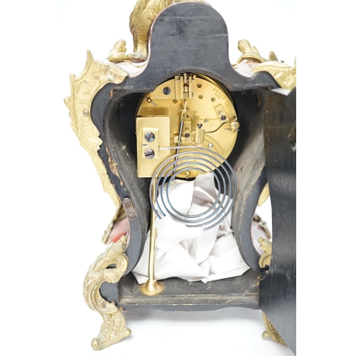 1374 - An early 20th century French tortoiseshell mantel clock with dragon mount, 30cm