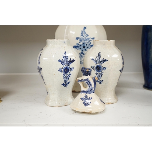 1379 - An 18th century Delft blue and white vase and a pair of later Delft vases and covers, tallest 23.5cm... 