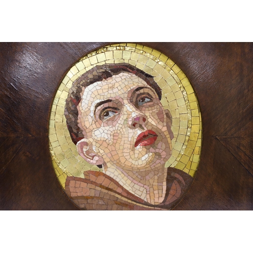 1384 - An Italian mosaic oval panel of a saint in a mahogany frame, panel 23cm high x 19cm wide