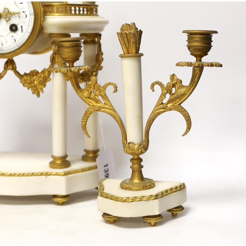 1399 - A 19th century French ormolu and white marble clock garniture striking on a gong, the dial decorated... 