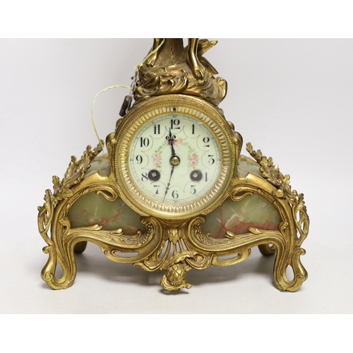 1404 - A French figurative gilt metal and green onyx mantel clock with hand painted dial, 51cm high