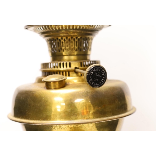 1410 - A Victorian brass oil lamp with glass shade, two brass chargers and a match box cover, oil lamp 72 c... 