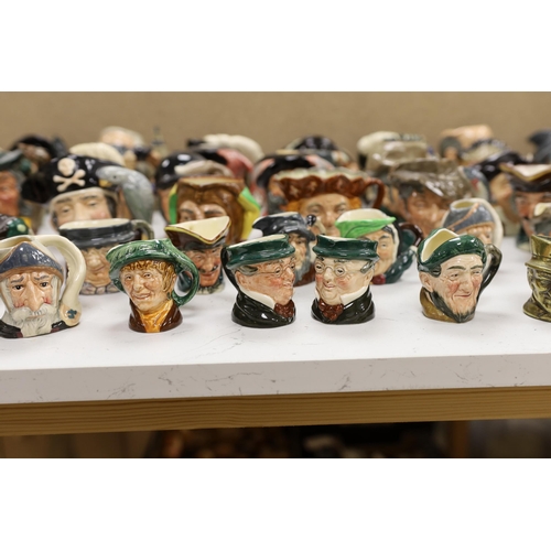 1418 - A large collection of Doulton character jugs including the Three Musketeers and Bacchus, largest 10c... 