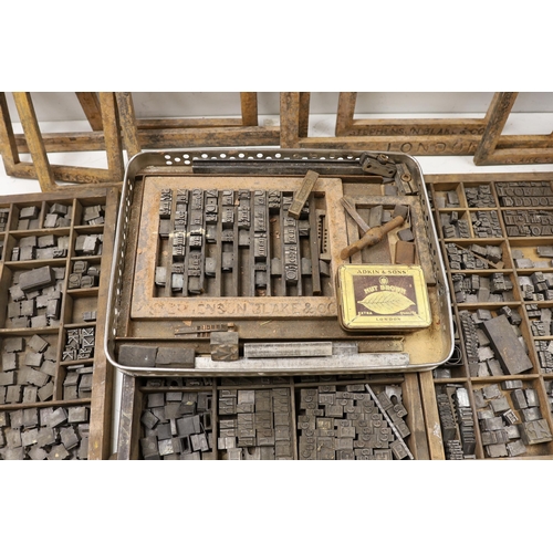 1428 - Three trays of metal printing type: chases, quoins and spacing bars