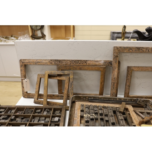 1428 - Three trays of metal printing type: chases, quoins and spacing bars