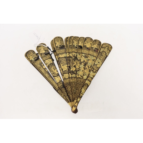 1446 - A mid 19th century Chinese gilt decorated black lacquer brise fan, 23cm in length