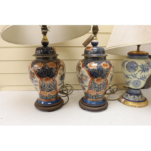 1459 - A pair of Chinese crackleware lamps, 40cm high, and a European pottery lamp (3)