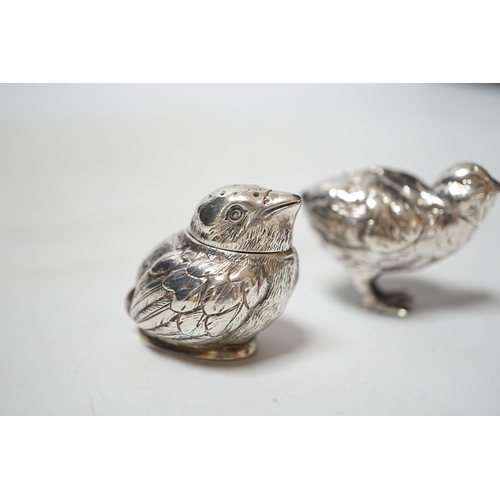 1915 - Two novelty silver pepperettes, modelled as chicks, the smallest with import marks for London, 1925,... 