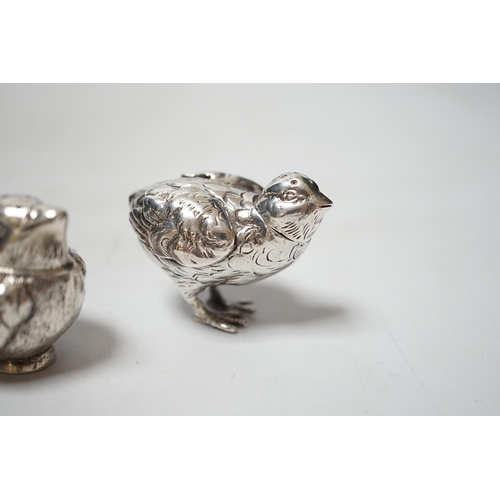 1915 - Two novelty silver pepperettes, modelled as chicks, the smallest with import marks for London, 1925,... 