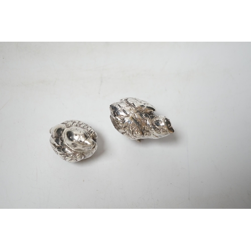 1915 - Two novelty silver pepperettes, modelled as chicks, the smallest with import marks for London, 1925,... 