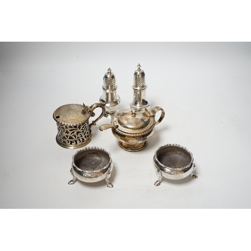 1924 - A collection of small silver items to include a pair of Georgian cauldron salts, two mustard pots in... 