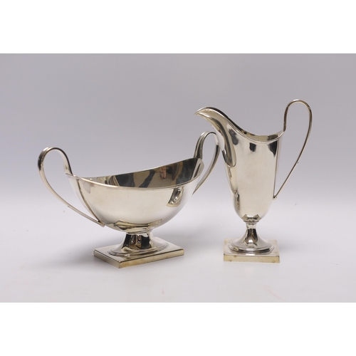 1928 - A George VI silver cream jug and two handled sauceboat by Viners Ltd, Sheffield, 1937, jug height 13... 