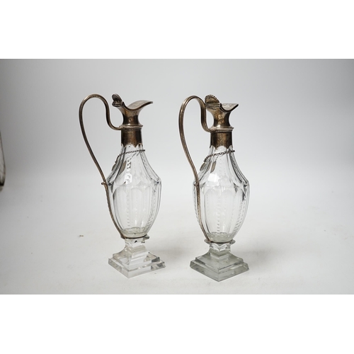 1929 - A pair of late 18th/early 19th century silver mounted cut glass cut glass cruet bottles with labels ... 