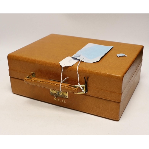 1931 - A George VI  pig skin travelling vanity case, containing fourteen engine turned silver gilt mounted ... 