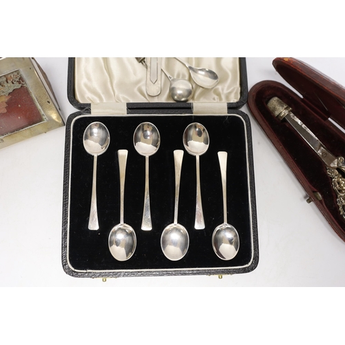 1934 - A cased pair of late Victorian repousse silver handled scissors and later silver thimble, a silver m... 