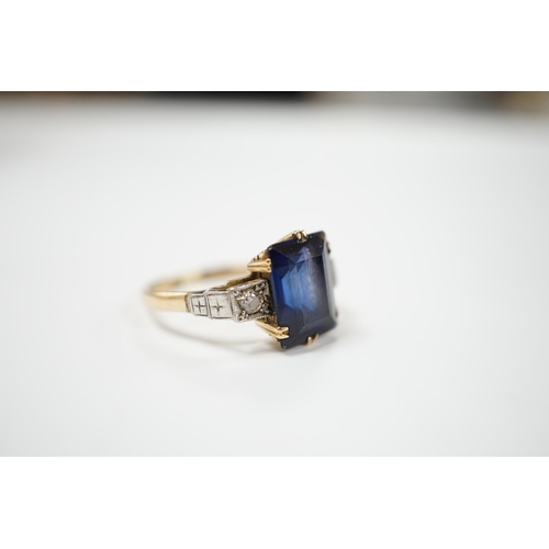 1976 - An 18ct, plat and single stone emerald cut synthetic? sapphire set dress ring with diamond set shoul... 