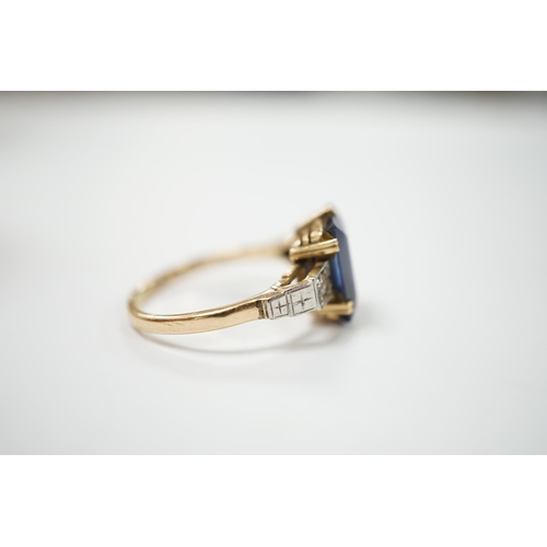 1976 - An 18ct, plat and single stone emerald cut synthetic? sapphire set dress ring with diamond set shoul... 