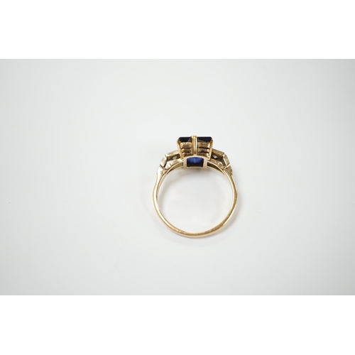 1976 - An 18ct, plat and single stone emerald cut synthetic? sapphire set dress ring with diamond set shoul... 