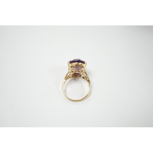 1978 - A modern 9ct gold and oval cut amethyst set dress ring, size M, gross weight 5.9 grams.