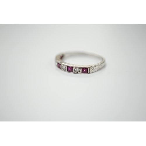 1981 - A modern 18ct white gold, ruby and diamond set half eternity ring, size O, gross weight 2.7 grams.... 