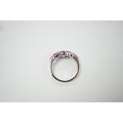 1982 - A modern 14k white metal, pink sapphire and diamond cluster set half hoop ring (two sapphires loose)... 