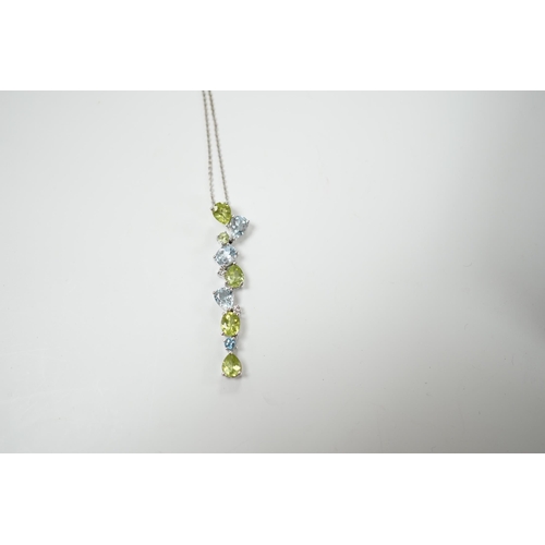 1983 - A modern 9ct white gold, peridot and blue topaz set pendant, 37mm, on a 375 chain, 40cm, gross weigh... 