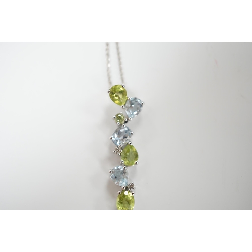 1983 - A modern 9ct white gold, peridot and blue topaz set pendant, 37mm, on a 375 chain, 40cm, gross weigh... 