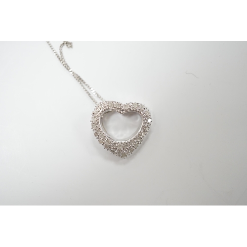 1987 - A modern 375 white metal and diamond chip set heart shaped pendant on chain, overall 42cm, gross wei... 