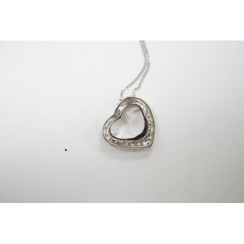 1987 - A modern 375 white metal and diamond chip set heart shaped pendant on chain, overall 42cm, gross wei... 