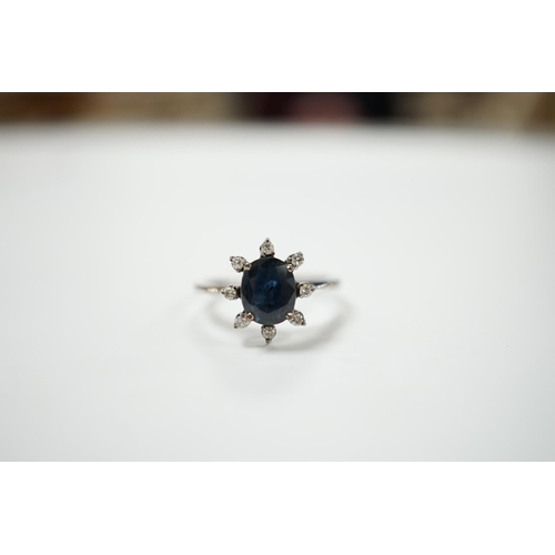 1990 - An 18k white metal, sapphire and diamond set cluster ring, size L, gross weight 2.5 grams.